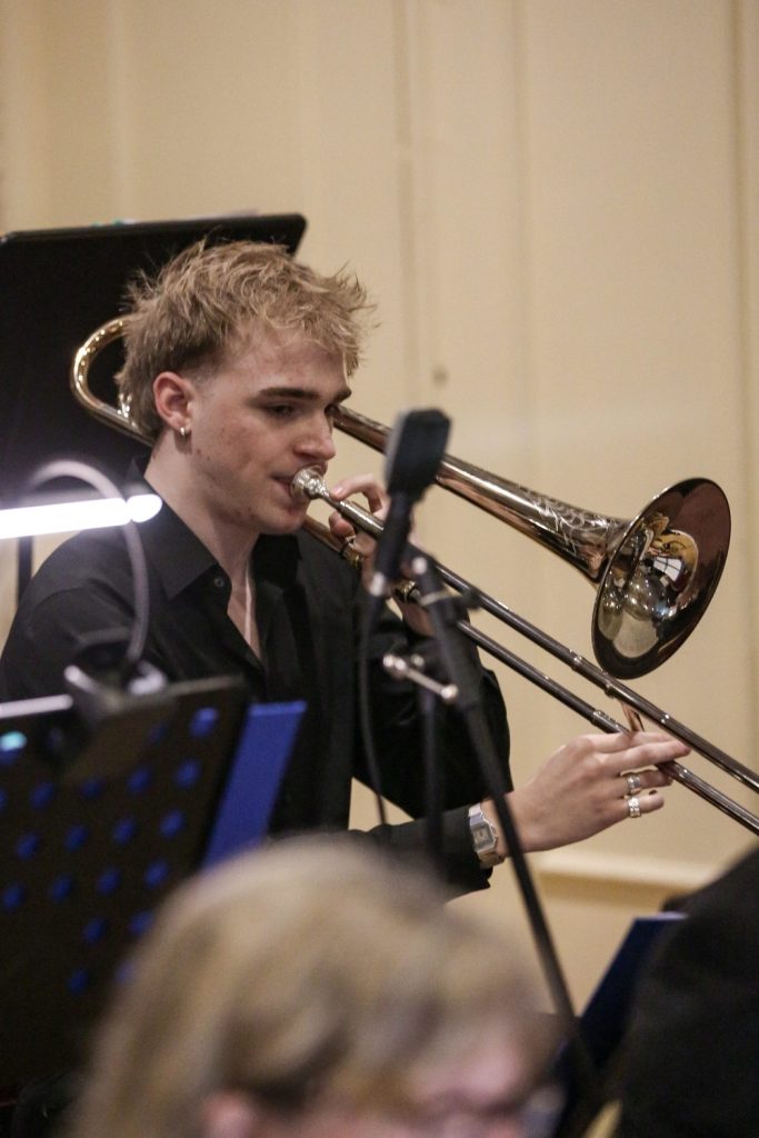 Trombone player in orchestra setting